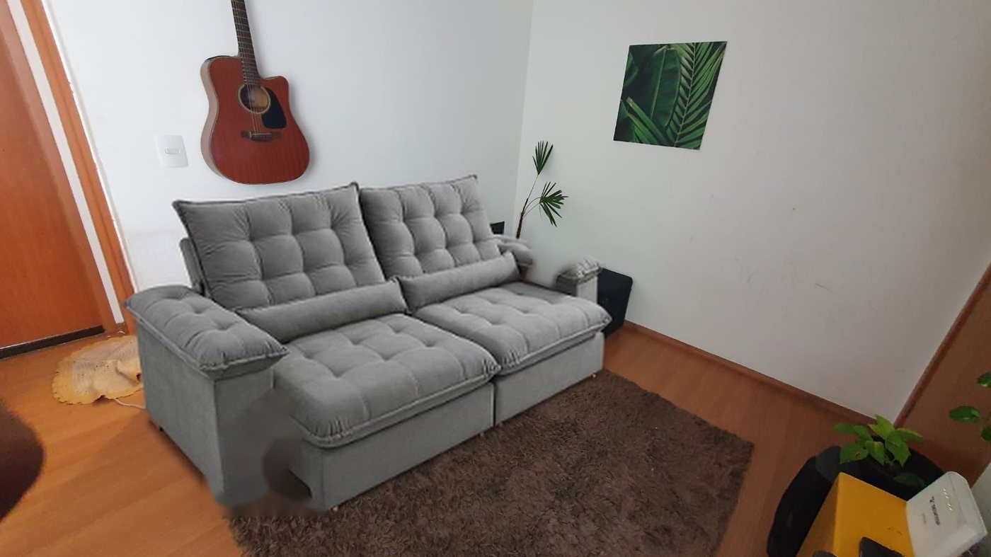 Sofá cinza simulado na sala do cliente